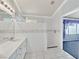 Bathroom features white single sink vanity, subway tile shower, and mosaic tile accents at 6151 Naha Port Ave, Las Vegas, NV 89110
