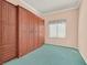 Bedroom with custom wood wardrobe and green carpet at 6151 Naha Port Ave, Las Vegas, NV 89110