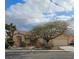 Charming single-story home with a tile roof and mature landscaping, offering great curb appeal at 6151 Naha Port Ave, Las Vegas, NV 89110