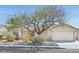 Charming single-story home with desert landscaping, tiled roof and attached two-car garage in a quiet neighborhood at 6151 Naha Port Ave, Las Vegas, NV 89110