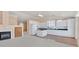 Bright kitchen featuring white cabinetry, granite countertops, and center island providing extra counter space at 6151 Naha Port Ave, Las Vegas, NV 89110