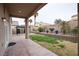 Nice backyard space with covered patio and a landscaped grassy area at 6440 N Bruce St, North Las Vegas, NV 89086