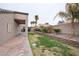 Lush backyard features a patio, lawn, mature landscaping, and privacy wall at 6440 N Bruce St, North Las Vegas, NV 89086