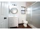 A bathroom with a vanity, toilet, and glass door shower at 6440 N Bruce St, North Las Vegas, NV 89086