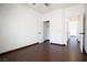 Bedroom featuring tile floors, closet, and a doorway to another room at 6440 N Bruce St, North Las Vegas, NV 89086