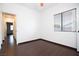 Bedroom featuring tile floors and a window at 6440 N Bruce St, North Las Vegas, NV 89086
