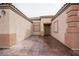 A close up of the entrance to the home with tiled flooring and a well-lit doorway at 6440 N Bruce St, North Las Vegas, NV 89086