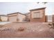 Well-maintained single-story home with two-car garage and desert landscaping at 6440 N Bruce St, North Las Vegas, NV 89086