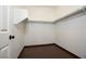 Walk-in closet with ample shelving and wood-look flooring; ideal for organizing clothes and accessories at 6440 N Bruce St, North Las Vegas, NV 89086