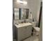 Bathroom featuring a gray vanity with a white sink and a mirror mounted to the wall at 7139 S Durango Dr # 218, Las Vegas, NV 89113