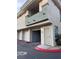 Charming townhouse featuring an open garage and an enclosed balcony with a neutral stucco exterior at 7139 S Durango Dr # 218, Las Vegas, NV 89113