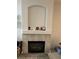 Stylish fireplace with a decorative mantle and tile surround, perfect for cozy evenings at 7139 S Durango Dr # 218, Las Vegas, NV 89113