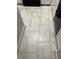 Neutral tiled flooring with modern kitchen cabinetry at 7139 S Durango Dr # 218, Las Vegas, NV 89113
