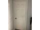 Classic six-panel interior door painted white, adding charm to the home's design at 7139 S Durango Dr # 218, Las Vegas, NV 89113