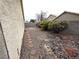 Backyard features stone, rocks, bushes, and trees at 7209 London Bridge Ave, Las Vegas, NV 89130