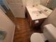 Bright bathroom with a dual-sink vanity, tile floors, and a modern toilet at 7209 London Bridge Ave, Las Vegas, NV 89130