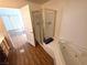 Bathroom showcasing a glass-enclosed shower, jacuzzi tub, and vanity at 7209 London Bridge Ave, Las Vegas, NV 89130