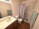 Full bathroom with a shower-tub combination, single sink vanity, and neutral decor at 7209 London Bridge Ave, Las Vegas, NV 89130