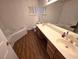 Spacious bathroom featuring dual vanity, a bathtub, and modern fixtures at 7209 London Bridge Ave, Las Vegas, NV 89130