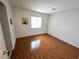 Bright and airy bedroom with wood floors, a window, and ample natural light at 7209 London Bridge Ave, Las Vegas, NV 89130