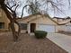 Attractive single-story home featuring a two-car garage and a tidy front yard, perfect for suburban living at 7209 London Bridge Ave, Las Vegas, NV 89130