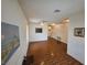 Open-concept living room boasts laminate flooring, ceiling fan, neutral walls, and lots of natural light at 7209 London Bridge Ave, Las Vegas, NV 89130