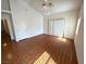 Large living room with high ceiling, hardwood floors, neutral paint, and a sliding door at 7209 London Bridge Ave, Las Vegas, NV 89130