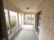Enclosed sunroom with windows and a sliding door at 7209 London Bridge Ave, Las Vegas, NV 89130