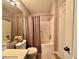 Functional bathroom featuring a shower-tub combination, modern fixtures, and a neutral color palette at 7400 W Flamingo Rd # 2058, Las Vegas, NV 89147