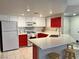 Well-lit kitchen features white cabinets, a quartz countertop, and stainless steel appliances at 7400 W Flamingo Rd # 2058, Las Vegas, NV 89147