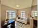 Bright home office with ample natural light and a comfortable seating area at 7400 W Flamingo Rd # 2058, Las Vegas, NV 89147
