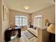 Bright home office with ample natural light and a comfortable seating area at 7400 W Flamingo Rd # 2058, Las Vegas, NV 89147