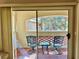 Charming patio with outdoor seating, offering a relaxing space to enjoy views of surrounding trees at 7400 W Flamingo Rd # 2058, Las Vegas, NV 89147