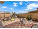 Spacious backyard with a tiled patio area, perfect for outdoor entertaining and relaxation at 7832 Hamilton Pool Dr, Las Vegas, NV 89113