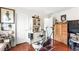 Cozy bedroom with hardwood floors, a large wardrobe, and natural light, perfect for relaxation at 7832 Hamilton Pool Dr, Las Vegas, NV 89113