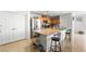 Bright kitchen with stainless steel appliances, tan cabinets, and large island at 7832 Hamilton Pool Dr, Las Vegas, NV 89113