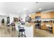 Spacious kitchen featuring a large island with bar stools, stainless appliances, and tile floors at 7832 Hamilton Pool Dr, Las Vegas, NV 89113