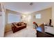 Cozy bedroom featuring a comfortable couch, desk, and soft carpeting at 8240 Campana Dr, Las Vegas, NV 89147