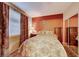 Cozy bedroom with a decorative motif, window for natural light, and mirrored closet at 8240 Campana Dr, Las Vegas, NV 89147