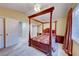 Spacious bedroom with a decorative four-poster bed and large windows for ample natural light at 8240 Campana Dr, Las Vegas, NV 89147