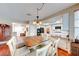 Open concept kitchen connected to a dining area and featuring granite countertops and modern appliances at 8240 Campana Dr, Las Vegas, NV 89147