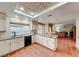 Open kitchen with granite countertops, a center island, and breakfast nook overlooking backyard at 8240 Campana Dr, Las Vegas, NV 89147