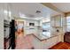 Bright and airy kitchen with granite countertops, tile floors, and large windows for natural light at 8240 Campana Dr, Las Vegas, NV 89147