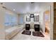 Luxurious main bathroom featuring dual sinks, soaking tub, and tiled finishes throughout at 8240 Campana Dr, Las Vegas, NV 89147