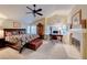 Bright main bedroom offering a fireplace, desk area, and a vaulted ceiling at 8240 Campana Dr, Las Vegas, NV 89147