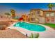Inviting backyard pool with a charming home exterior and lush landscaping at 8240 Campana Dr, Las Vegas, NV 89147