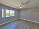 Bright bedroom with light walls, light floors and a view of the green landscape at 8600 W Charleston Blvd # 2089, Las Vegas, NV 89117