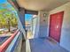 Inviting private entrance with a red door and a view of the community at 8600 W Charleston Blvd # 2089, Las Vegas, NV 89117