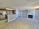 Open-concept layout with a modern kitchen, stainless appliances and a fireplace at 8600 W Charleston Blvd # 2089, Las Vegas, NV 89117