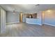 Spacious living room with gray walls, light floors and an open layout to kitchen at 8600 W Charleston Blvd # 2089, Las Vegas, NV 89117